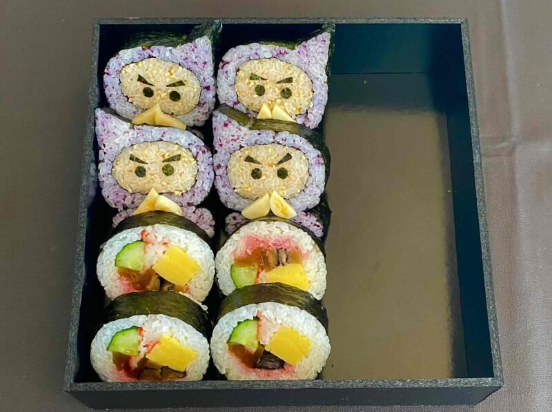 Pack sushi into lunch boxes