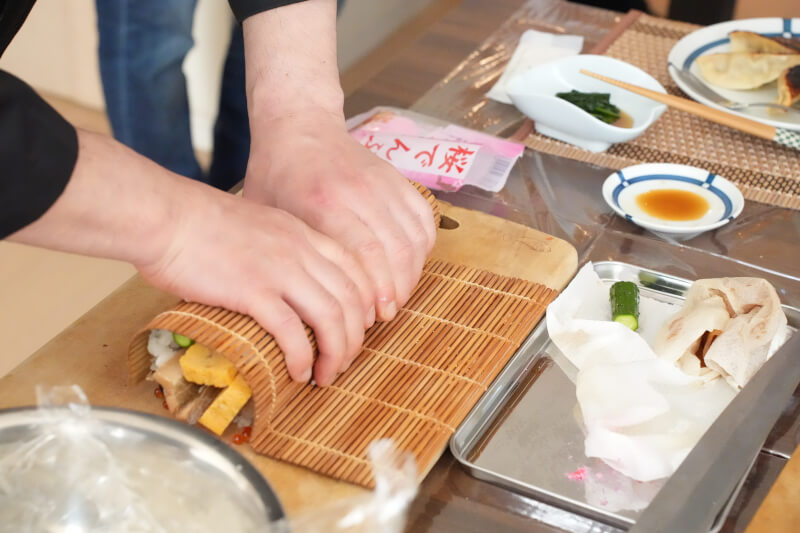 Place rice and ingredients on seaweed and make a sushi roll