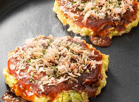 Experience cooking Osaka's famous okonomiyaki and yakisoba