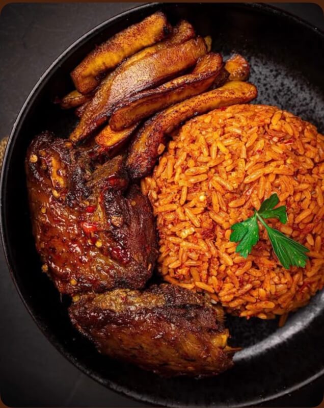 GHANA JOLLOF WITH KELEWELE, A HIBISCUS DRINK (SOBOLO) AND A SIDE PUFF PUFF SNACK
