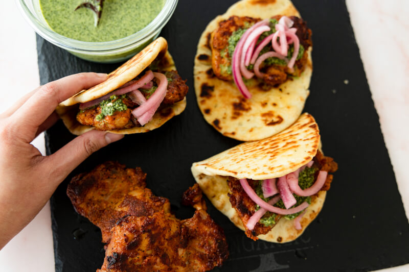 Indian & Western Fusion with Tandoori Chicken Burgers served with pickled onions & Mint Chutney